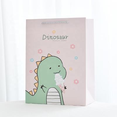 China Recycled Cute Materials Cartoon Gift Bag Dinosaur Handbag Paper Bag Clothing Shopping Bag for sale