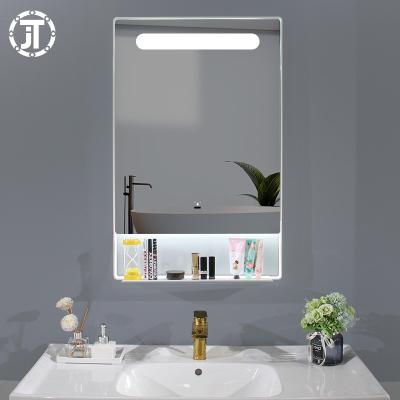 China Illuminated Bath Mirrors With Shelf Framed Bathroom Shower Mirror for sale