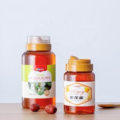 China Honey Bottles Round Shape 300g500g1000g Crystal Honey Food Clear Pet Food Grade Double Layer Left Lid for sale