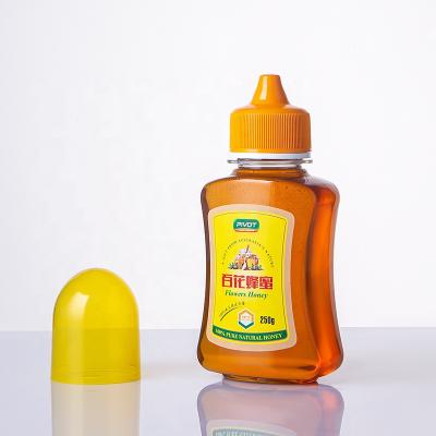 China High Quality PET Food 250g500g Transparent Honey Squeeze Plastic Bottle With Double Layer Screw Cap And Dustproof Cap Design Patent for sale