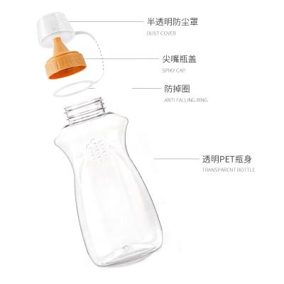 China Wholesale Food Gradae 500g800g1000g Led Mouth PET Honey Squeeze Bottle Extrusion Double Layer Plastic Lid With Bee Comb Pattern for sale