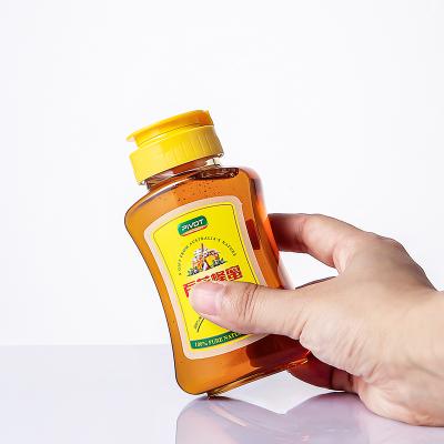 China Sample 380ml /500g Honey Free Pet Plastic Bottle With Silicone Valve Lid /Flip Top Lid For Salad Dressing Sauce Honey Squeeze Bottle for sale