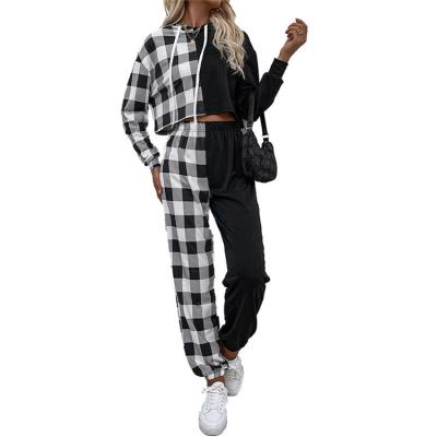 China Autumn Fashion Women Breathable Black And White Plaid Hoodie Sportswear Two Piece Splicing Suit Early for sale