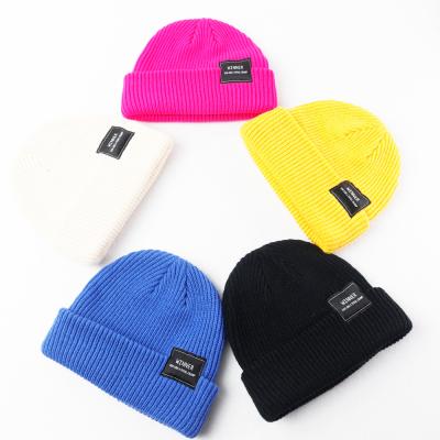 China Rich Colors Woven Patch Beanie Cap With High Quality Colorful Logo Custom Knitted Winter Hat From Wholesaler COMMON for sale