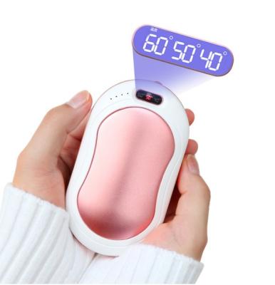 China Quick Charge Support 4 to 1 Rechargeable Hand Warmer Power Bank with Vibration Double Side 5s Massage Heating Quickly for sale