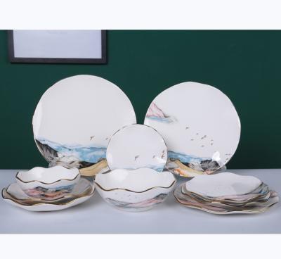 China Sustainable New Design Mountain Series Pattern Decal 10PCS Ceramic Dinnerware Sets Wave Edged With Gold Rim for sale