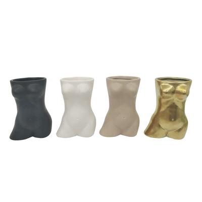 China Minimalist high-grade style plant tabletop containers butt vase-shaped creative ceramic female body shaped vase for sale