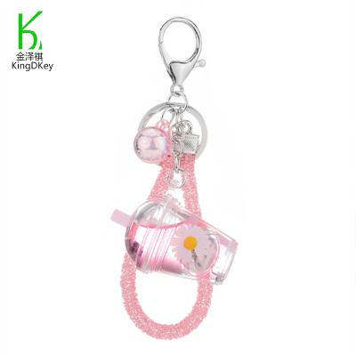 China New Mini Bottle Daisy Keychain Little Daisies Liquid Acrylic Quicksand Cup Oil Key Chain Creative Plastic Keychain for sale