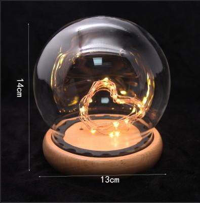 China Europe factory direct sale battery operated transparent glass dome with low light wooden bedside led table light for sale