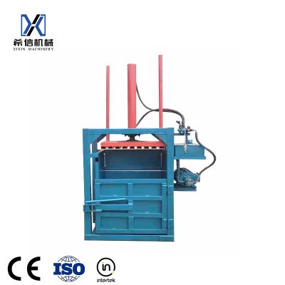 China Garment Shops Hydraulic Vertical Truck Car Used Tire Baler For Sale Scrap Trash Baler Machine For Sale for sale