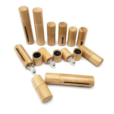 China Hot Selling Cosmetic Essential Oil Roller Bamboo Cosmetic Packaging Bottles with Stainless Steel Rollerballs Rollerball Container for sale