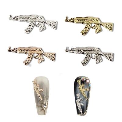 China America 2023 New Design Alloy 3D Shape Nail Art Decorations Luxury Punk Alloy Accessories Rhinestones Gun Nail Charms for sale