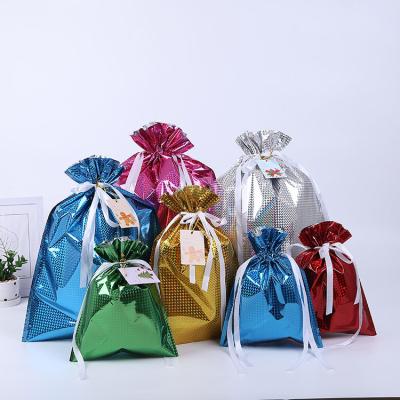 China Wholesale colorful desgin candy christmas up-to-date plastic drawstring gift bag sets for sale