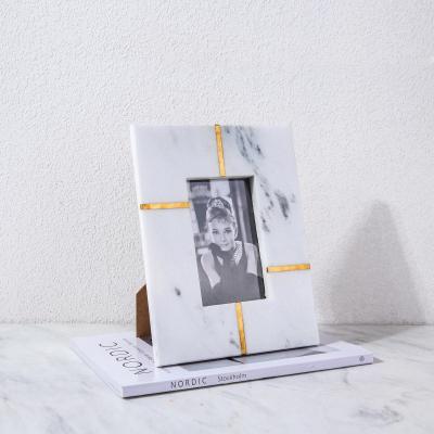 China Eco-friendly Nordic black and white marble photo frame luxurious marble photo frame decorated with brass lines for sale