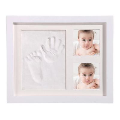 China Handmade+ECO-Friendly Baby First Year Handprint and Moment Footprint Clay Photo Frame Newborn Memorial Baby Photo Frame for sale