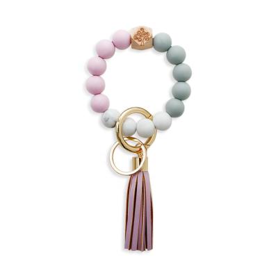 China Newest Amazon Hot Selling Leather Tassel Bohemia Silicone Bracelet Wood Beaded Bracelets Keychains For Women for sale