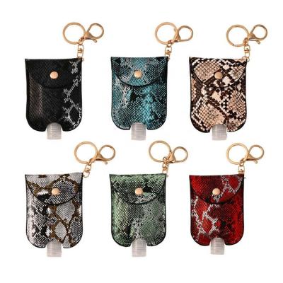 China Europe 30ml Leather Hand Sanitizer Bottles Leopard Snakeskin Disinfect Gel Bottles Refillable Bottles With Key Chain Holder for sale