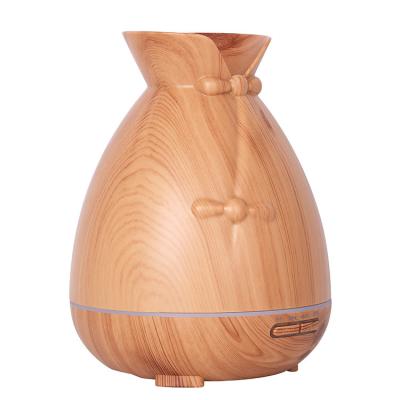 China Aromatherapy + Speaker 550ML Electric Wood Grain Diffuser Ultrasonic Air Humidifier with LED 7 Color Lamp for Bedroom Office for sale