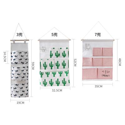 China Eco-friendly Storage Room Punch-free Wall Hanging Multi-Grid Hanging Cloth Pocket Door Storage Bag Shop Bag Back Bag for sale