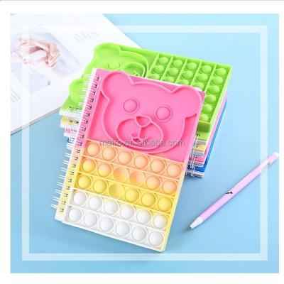 China Eco-friendly Paper Hot Selling Silicone Notebook Cover Spiral Noise Buster Custom Notebook Cuadernos Pop It Notebook for sale