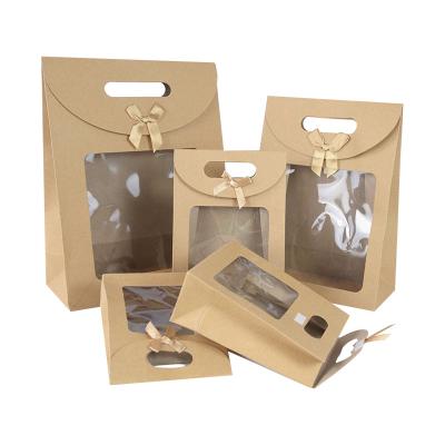 China Recycled Materials Portable gift bag with transparent window, suitable for wedding birthday party transparent brown paper bag candy packaging for sale