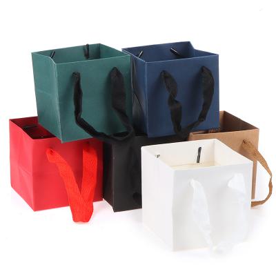 China Recycled Materials Mini 10*10cm square hand-held kraft paper bag flowers shopping clothes wig bags plants birthday wedding gift bags for sale