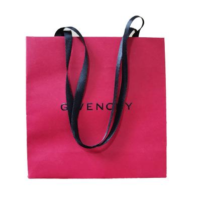 China Customized Printed Eco Friendly Recycled Materials Cosmetics Paper Bags With Ribbon Handle for sale