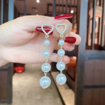 China Wholesale New Cocos Cring Pearl Hawaiian Earrings Long Tassel Earrings Polynesian Simple Imitation Pearl Earrings Hawaiian Jewelry for sale