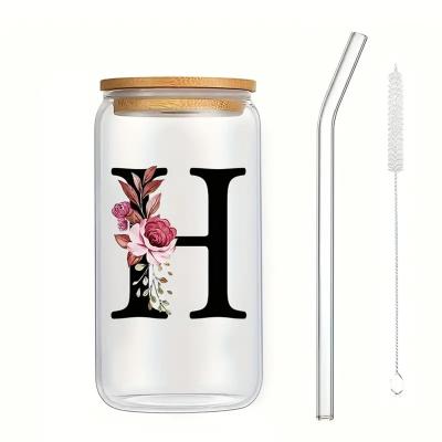 China Exquisite Customized Logo 16oz Sublimation Glass Water Bottle Clear Floral Letters Coke Can Glass Cups With Bamboo Lid And Straw 8*15cm for sale