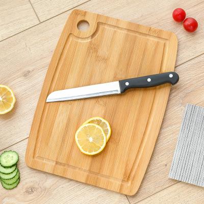 China Disposable Oval Bamboo Wooden Cutting Board with Juice Groove for Cutting Meat Vegetable Fruit for sale