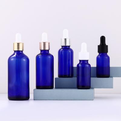 China 10ml 20ml 30ml 50ml 100ml Boston Glass Cosmetic Blue Round Bottle For Essential Oil Oil Dropper for sale