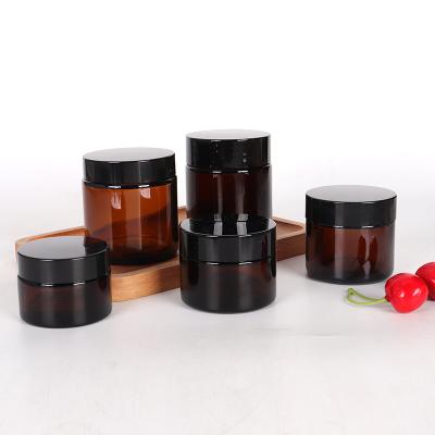 China Round Amber Cosmetic Glass Cream Jar Screw Lid Packaging Glass Cosmetic Jars Face Cream Glass Containers for sale