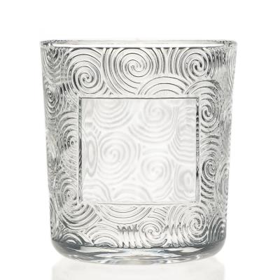 China Luxury Personal Care Candle Cup Glass Vessel Around Empty Embossed Candle Jar for sale