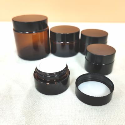 China Cosmetic Amber 10ml 50ml Matte Frosted Black Glass Cream Jar for sale