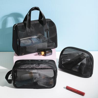 China Fashion New Large Capacity Storage Bag Wash Makeup Bag Three Sets Travel Storage Handbag Black Transparent Mesh Fashion Women for sale