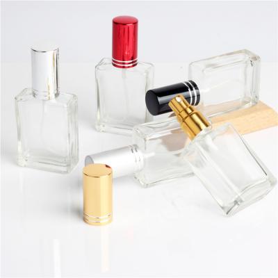 China Cosmetic in stock 15ml empty refillable square clear glass perfume bottles with colored aluminum spray for sale