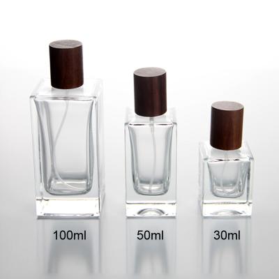 China 50ml cosmetic perfume bottle with rectangle shape with wooden cap for sale