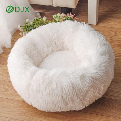 China Viable Soft Fluffy Round Soothing Donut Cat Dog Bed Warm And Comfortable Machine Washable Pet Sofa for sale