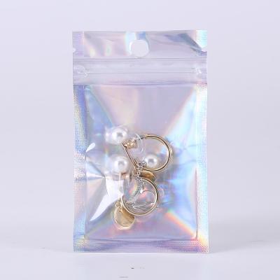 China 100pcs Magical self-sealing bag beauty jewelry bag color accessories individual digital seali moisture-proof laser seali for sale