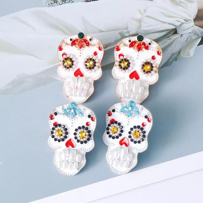 China 2022 Trendy Halloween Alloy Exaggerated Diamond Skull Drop Earrings Inlaid Pearl Stud Earrings For Women for sale