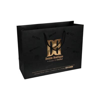 China Personality Recyclable Custom Printed Black Luxury Brand Clothing Retail Packaging Paper Bag With Logo for sale