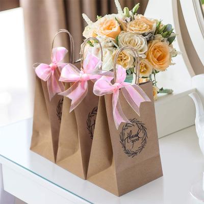 China Wholesale Cheap Price Luxury Gift Recyclable Custom Printed Kraft Paper Shopping Bag With Your Own Logo for sale