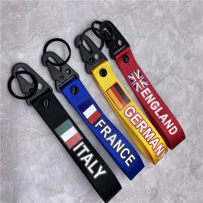 China Custom Cartoon Metal+Fabric Embroidery Keychains Logo Airplane Flight No Minimum Jet Custom Logo Woven Tag/Brand Keyring for sale