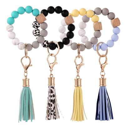 China Cuentas Llavero De Madera Main Bead Chain Bracelet Holographic Elastic Silicone Metal Suede Circle Wooden Tassel Bead Chain for sale