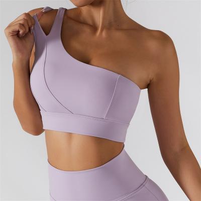 China Breathable Sports Bra Sexy Women Yoga Workout Padded One Shoulder Cut Out Tank Top Sleeveless Crop Tops Gym Wear Activewear Sportswear Bras for sale