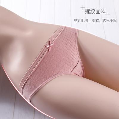 China Women's pure breathable thong young girls solid sexy low rise cotton breathable crotch underwear wholesale with bow stripe panties thongs for sale