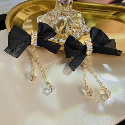 China 2022 Environmentally Friendly NEW Autumn And Winter Personality Women's Black Bow Diamond South Korea Earrings 925 Crystal Silver Needle Drop Earrings for sale