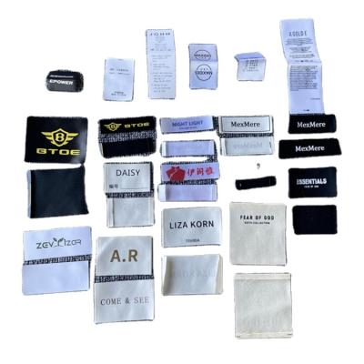 China Sustainable Fashion Garment Custom Machine Woven Waterproof Labels For Apparel Manufacturer for sale