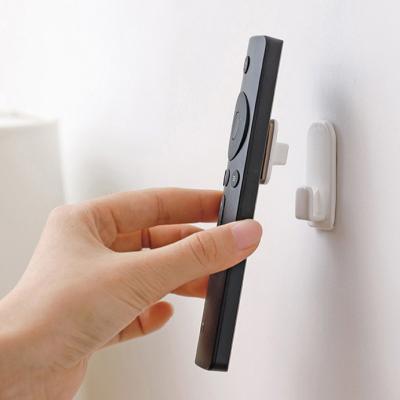 China Minimalist 2 Pieces One Wall Sticky Hook Storage Hook Set Remote Control Main Hook Storage Hooks for sale