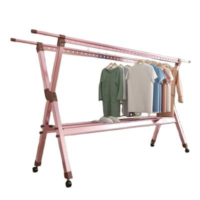 China Multifunctional Rack Expandable Drying Rod with Wheels Rolling Double Track Clothes Stretch Clothes Drying Rod Clothes Rack for sale